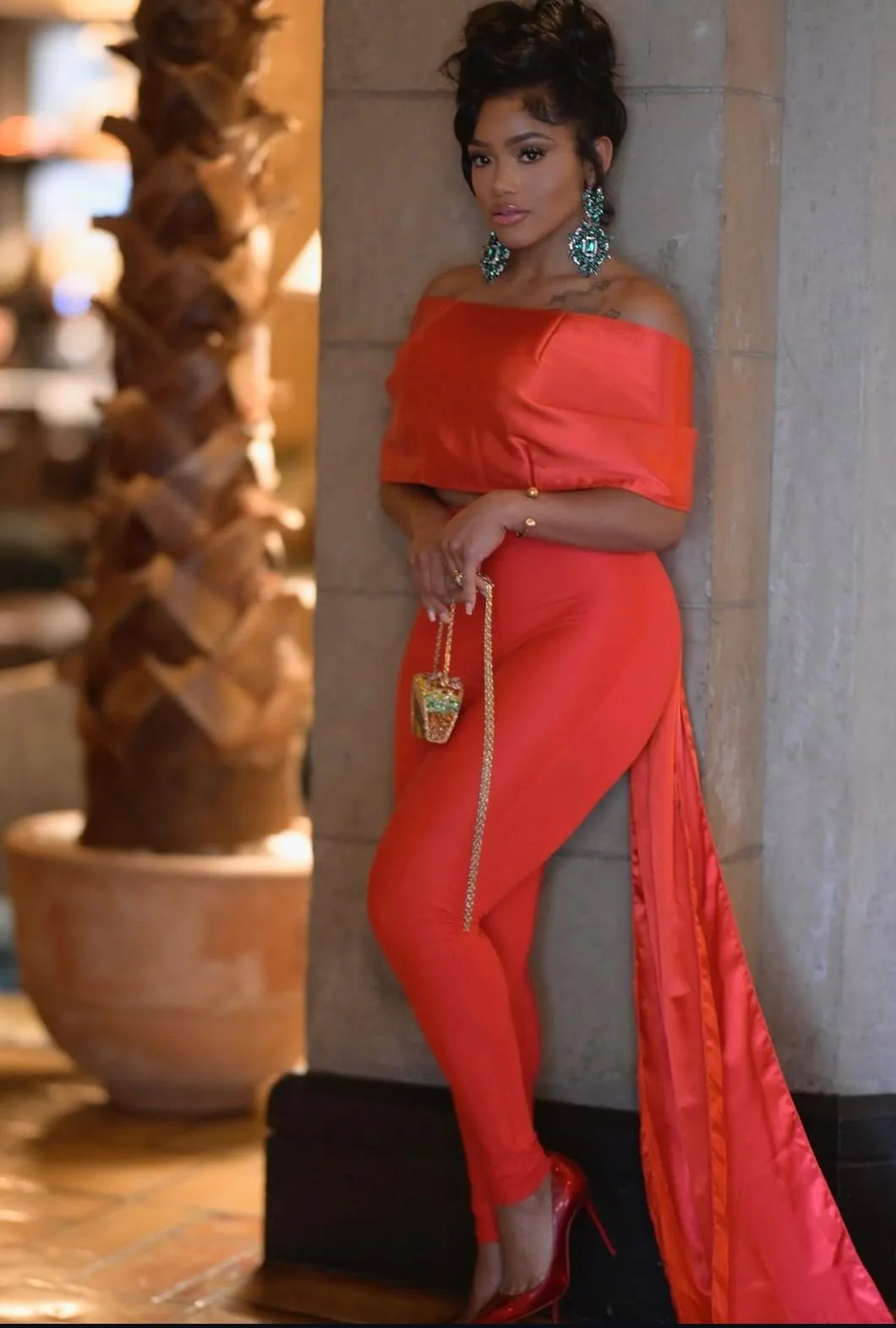 Actress Erica Pinkett in a red AltheaMink look, photo 2 of 7