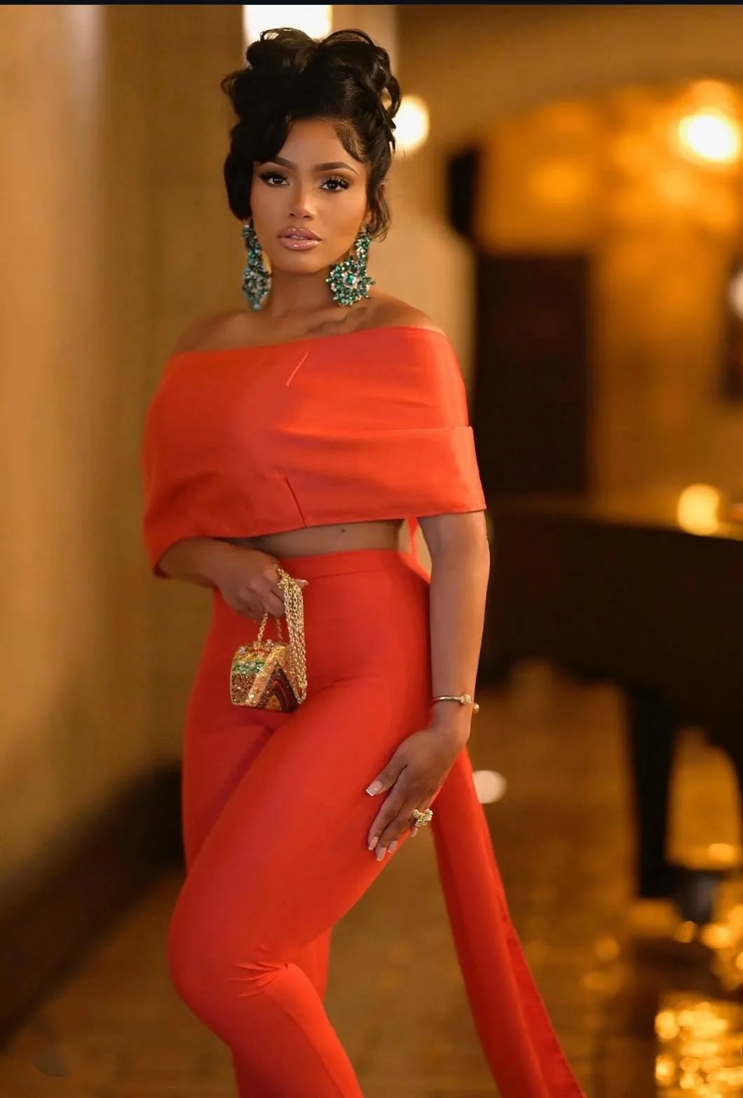 Actress Erica Pinkett in a red AltheaMink look, photo 3 of 7
