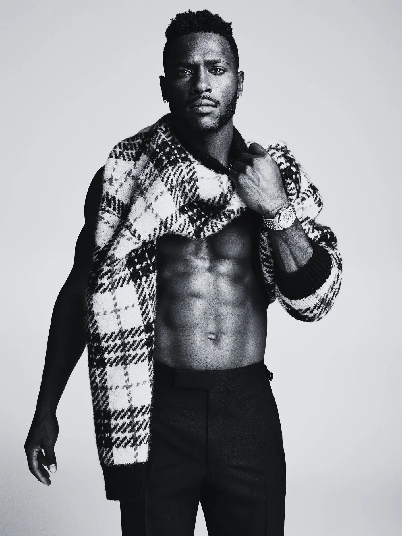 ALTHEAMEN oversized checked overcoat worn open, black and white editorial